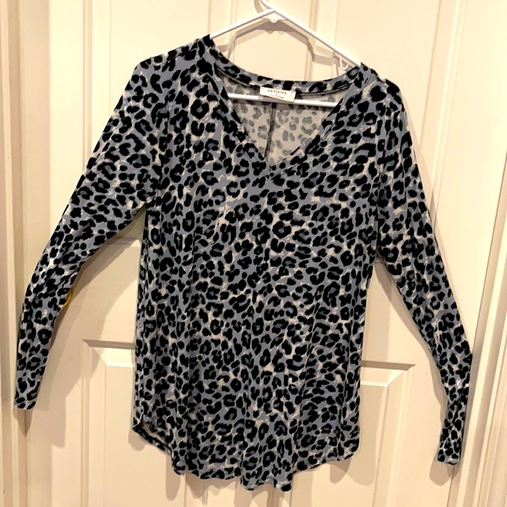 Women black and white animal print blouse. Size L